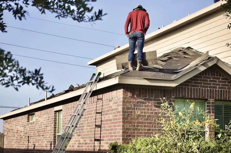 Professional roofer working on a residential roof in Kerrigan Ranch